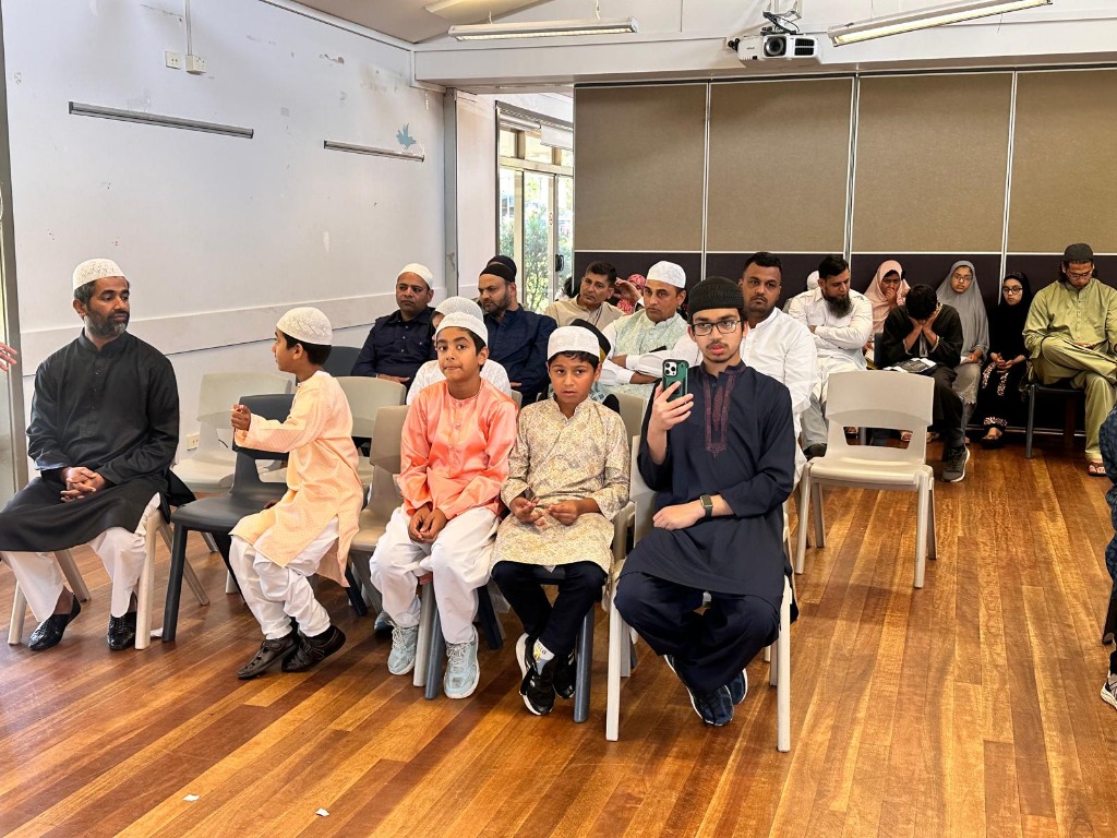 Children and community members attending a Deeni Academy class session